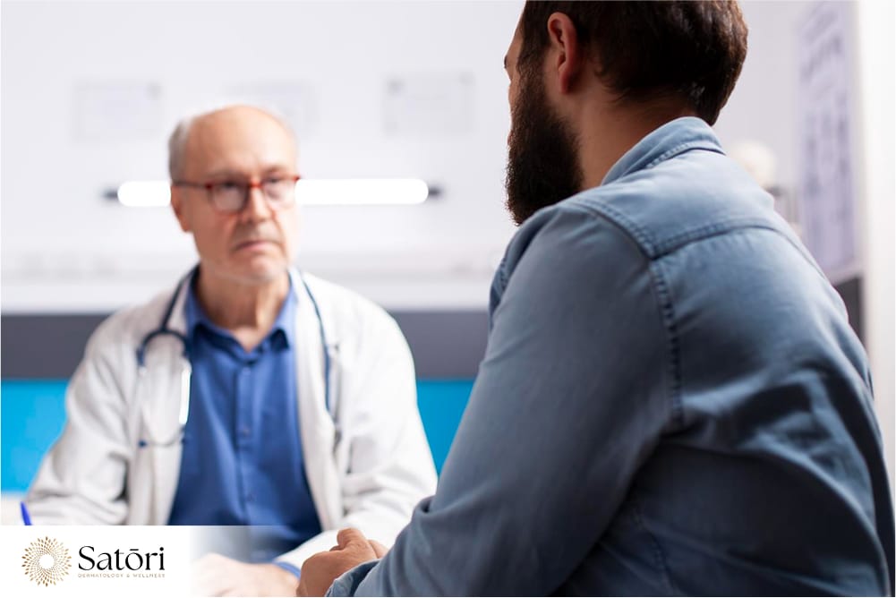 Man undergoing medical consult for erectile dysfunction at a clinic.